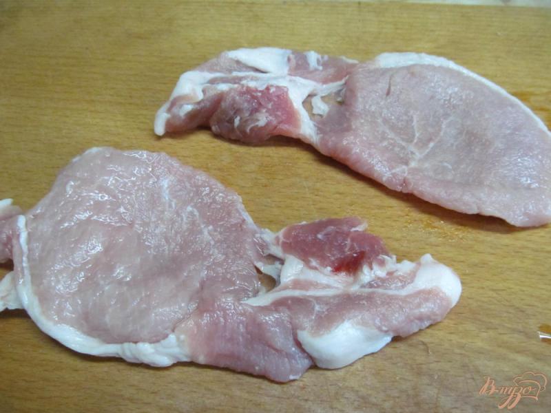 Фото приготовление рецепта: Свиные отбивные под ароматным маслом шаг №2