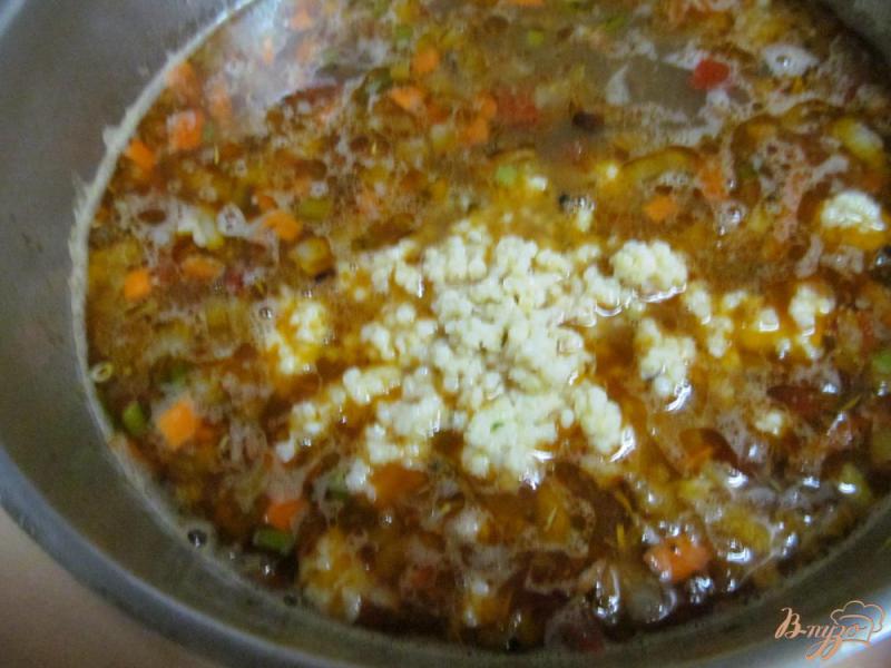 Фото приготовление рецепта: Густой суп из капусты с фаршем и пшеном шаг №6