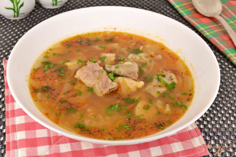 Фото приготовление рецепта: Острый суп с курицей, свининой и рисом шаг №9