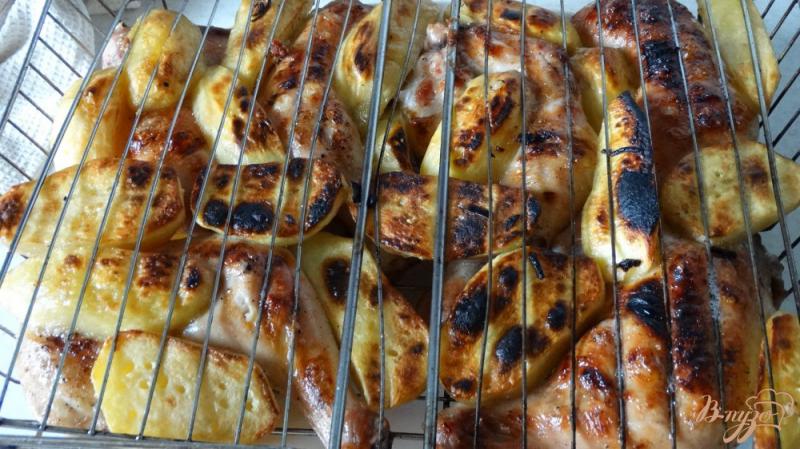 Фото приготовление рецепта: Окорочки в оливковом маринаде на мангале шаг №7