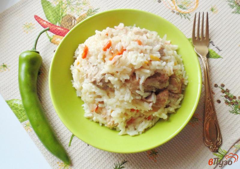Фото приготовление рецепта: Свинина с квашеной капустой и рисом шаг №9