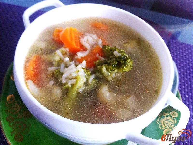 Фото приготовление рецепта: Рыбный суп с овощами и рисом шаг №5