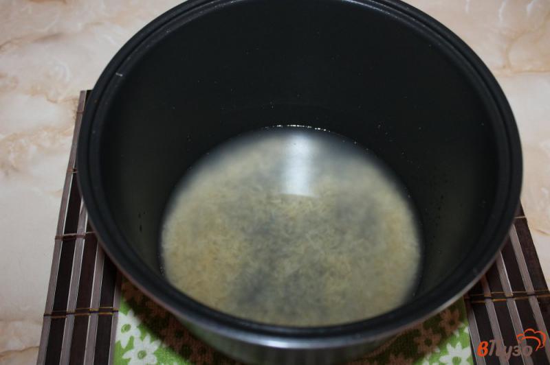Фото приготовление рецепта: Рис с карри, чесноком и сливочным маслом шаг №2