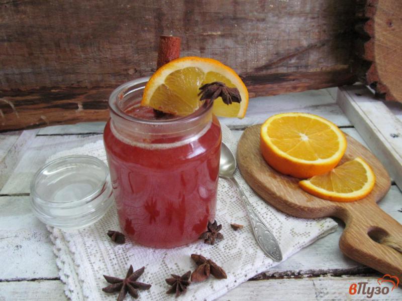 Фото приготовление рецепта: Горячий напиток из клюквы с апельсином шаг №7