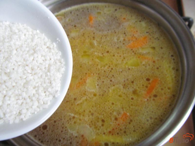 Фото приготовление рецепта: Рисовый суп с почками и щавелем шаг №7