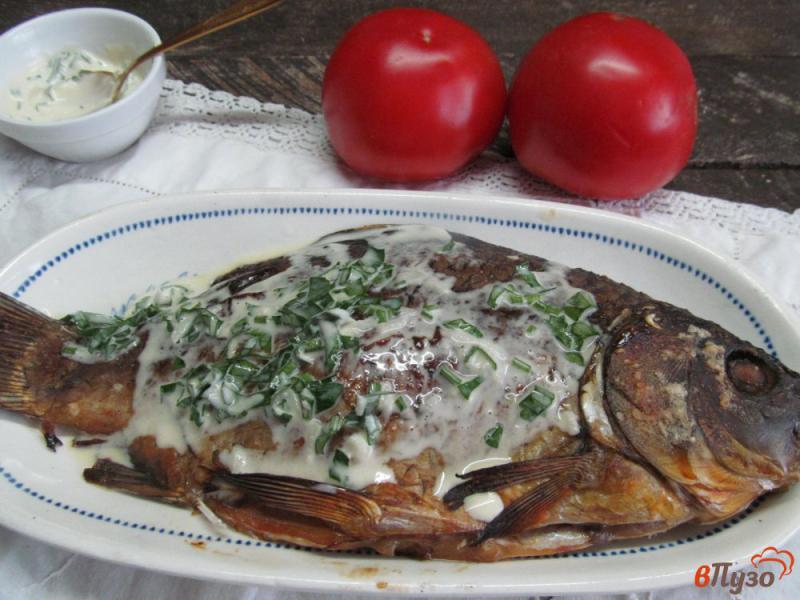 Фото приготовление рецепта: Запеченная рыба в маринаде с соусом шаг №6