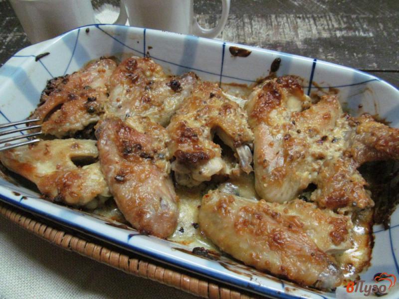 Фото приготовление рецепта: Запеченные маринованные куриные крылья шаг №5
