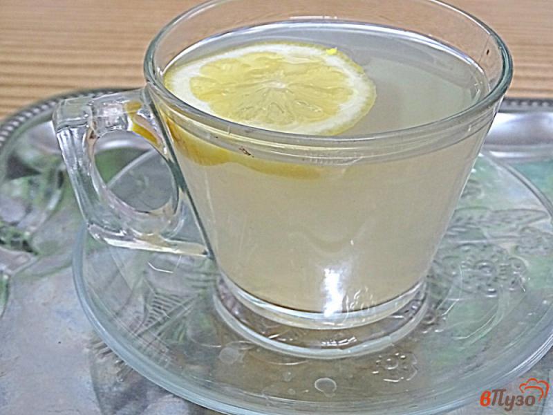 Фото приготовление рецепта: Имбирный чай с кардамоном и лимоном шаг №8