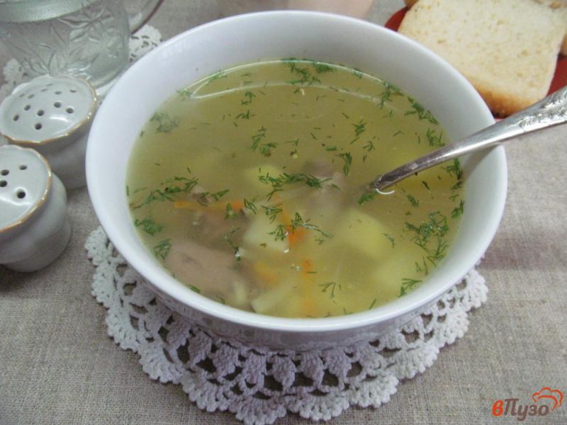 Фото приготовление рецепта: Суп на куриных потрохах и рисом и овощами шаг №7