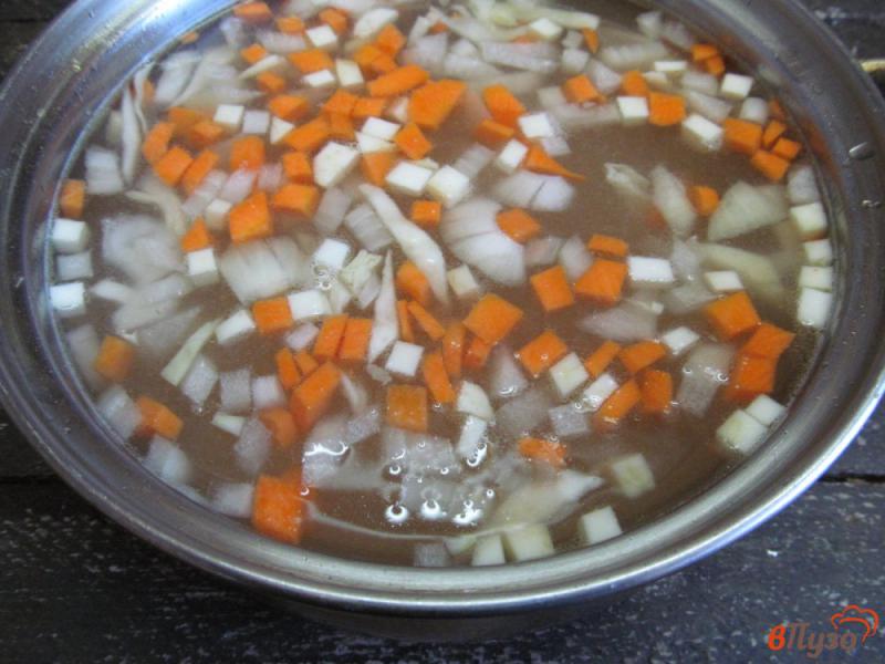 Фото приготовление рецепта: Суп с капустой и пшеном шаг №3