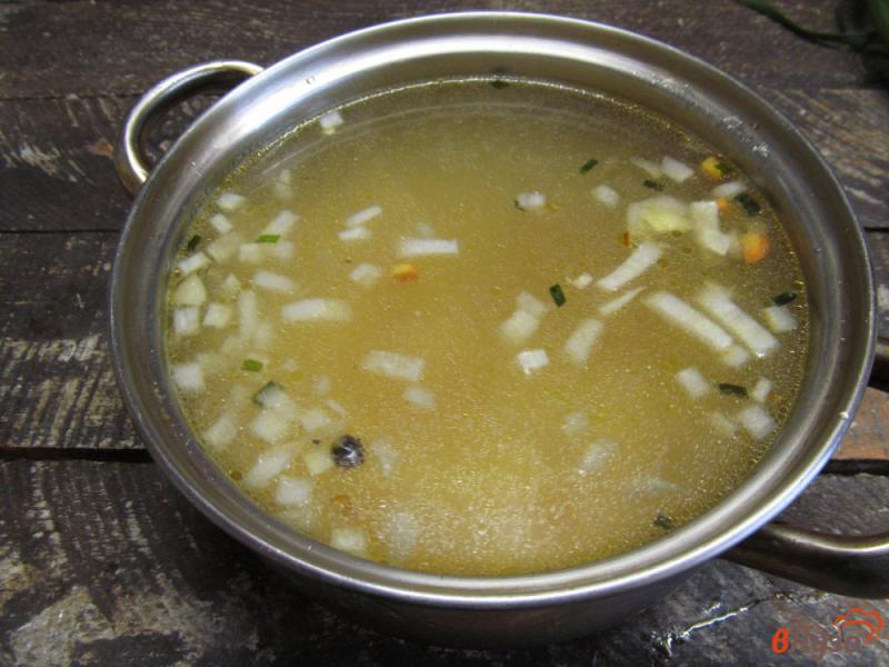 Фото приготовление рецепта: Рисовый суп с квашеной капустой шаг №4