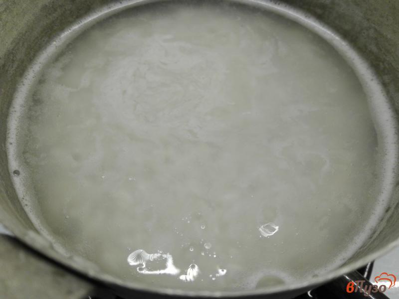 Фото приготовление рецепта: Рисовая каша как в детском саду шаг №2