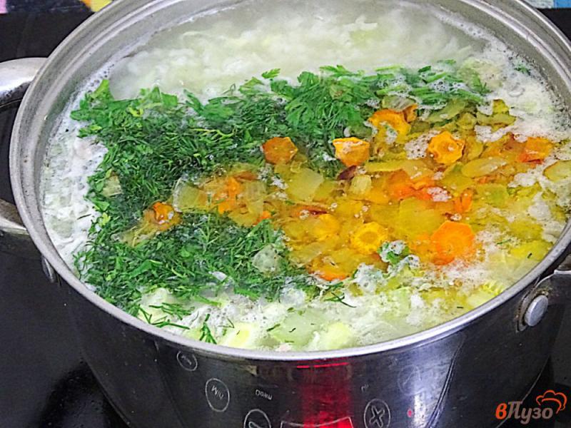 Фото приготовление рецепта: Суп с фрикадельками рисом и овощами шаг №7