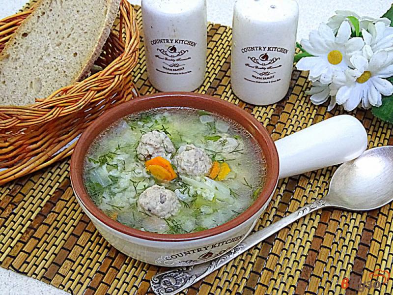 Фото приготовление рецепта: Суп с фрикадельками рисом и овощами шаг №9