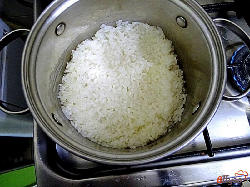 Фото приготовление рецепта: Каша рисовая на молоке шаг №3