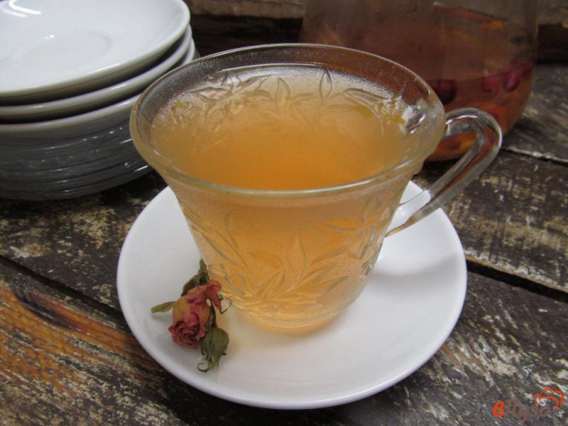 Фото приготовление рецепта: Клюквенный чай с мандарином и лавандой шаг №6