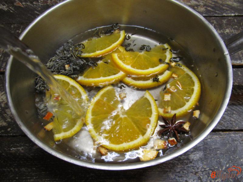 Фото приготовление рецепта: Апельсиновый чай шаг №4