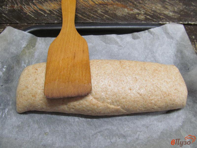 Фото приготовление рецепта: Хлеб цельнозерновой с розмарином и оливковым маслом шаг №7