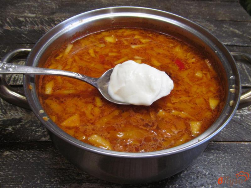 Фото приготовление рецепта: Томатный суп с маринованной капустой и кукурузной крупой шаг №10
