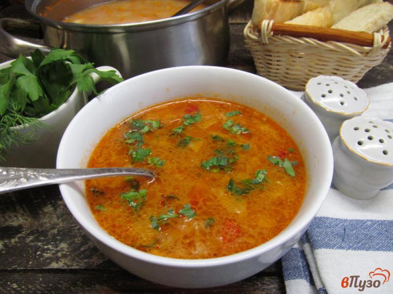 Фото приготовление рецепта: Томатный суп с маринованной капустой и кукурузной крупой шаг №11