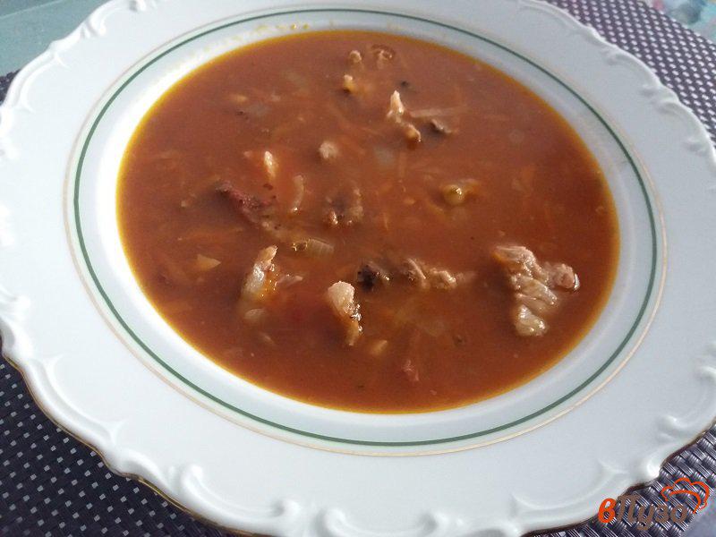 Фото приготовление рецепта: Томатный суп с чечевицей и копчеными ребрышками шаг №9