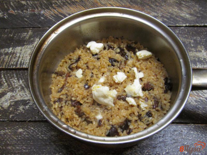 Фото приготовление рецепта: Овсяная каша с рисом и черносливом шаг №5