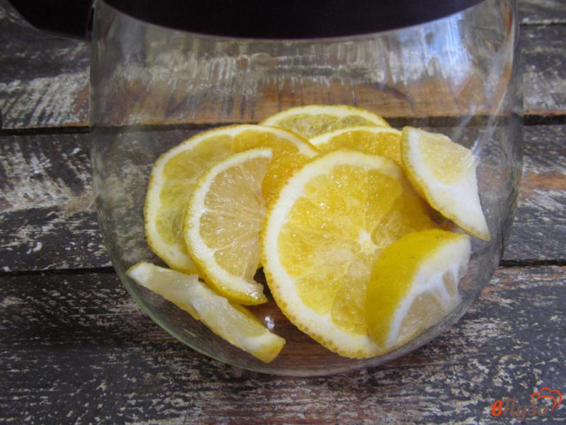 Фото приготовление рецепта: Цитрусовый чай с имбирем и калиной шаг №3