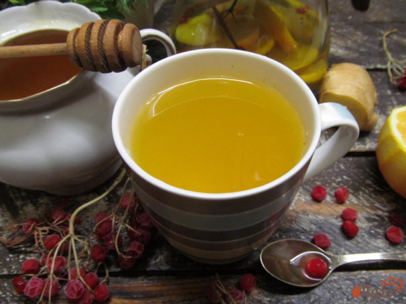 Фото приготовление рецепта: Цитрусовый чай с имбирем и калиной шаг №6