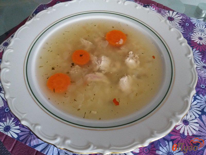 Фото приготовление рецепта: Куриный суп с рисом шаг №7