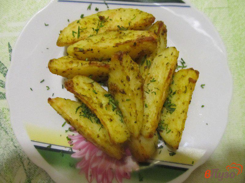 Фото приготовление рецепта: Запеченные дольки картофеля со специями по-турецки шаг №6