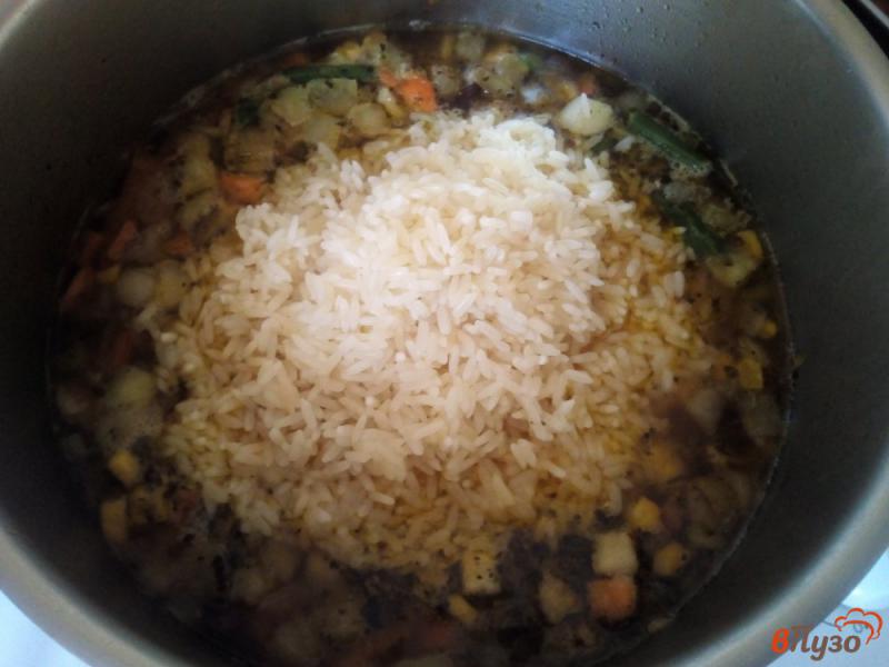 Фото приготовление рецепта: Рис с овощной мексиканской смесью и свининой шаг №7