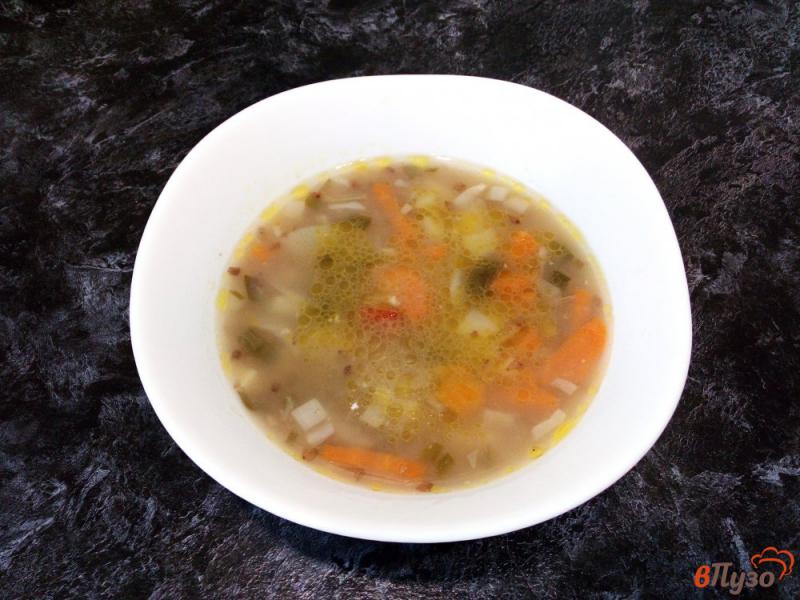 Фото приготовление рецепта: Гречневый суп с овощами и тушенкой шаг №9