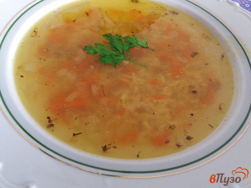 Фото приготовление рецепта: Куриный суп с рисом шаг №6