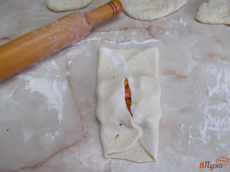 Фото приготовление рецепта: Пирожки на кефире с абрикосом шаг №9