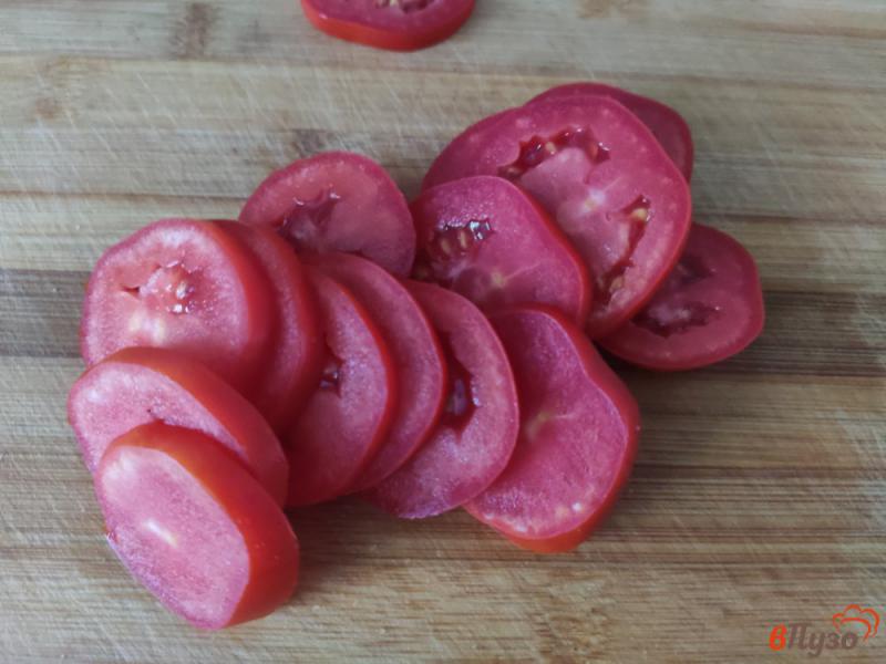 Фото приготовление рецепта: Жареные кабачки с помидорами шаг №6