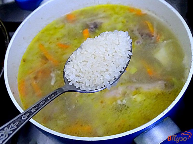 Фото приготовление рецепта: Острый фасолевый суп с рисом шаг №5