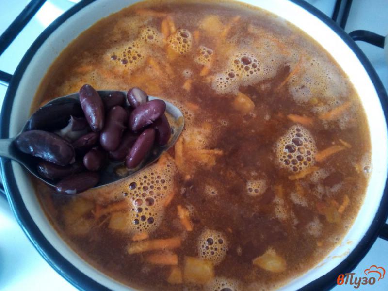 Фото приготовление рецепта: Томатный суп с рисом и фасолью шаг №6