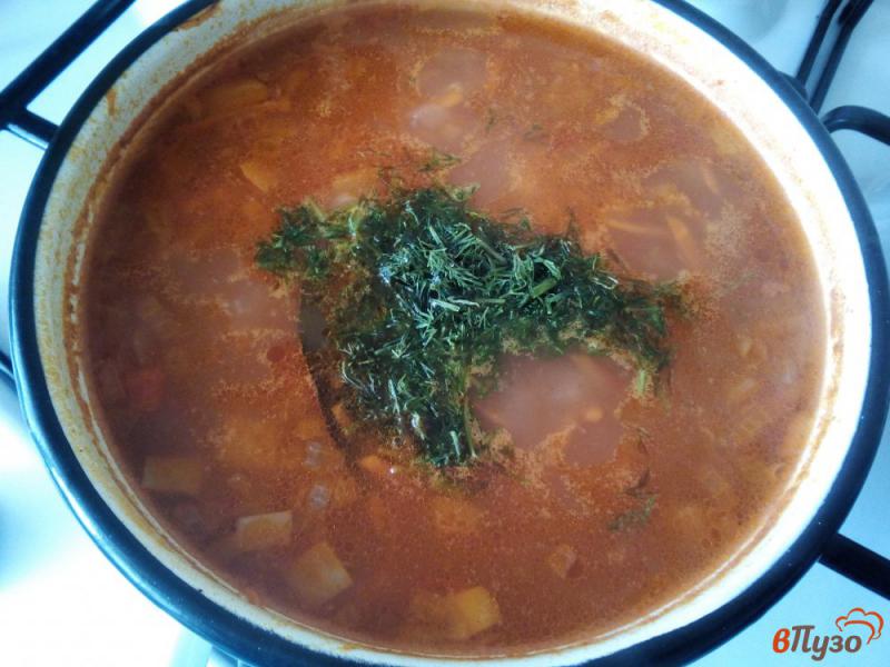 Фото приготовление рецепта: Томатный суп с рисом и фасолью шаг №7