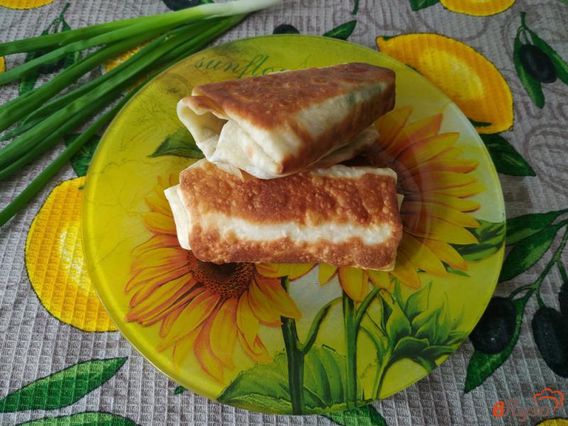 Фото приготовление рецепта: Закуска из лаваша с начинкой из грибов и плавленого сыра шаг №9