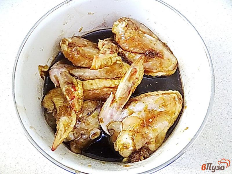 Фото приготовление рецепта: Куриные крылья запеченные в гранатовом соусе шаг №7