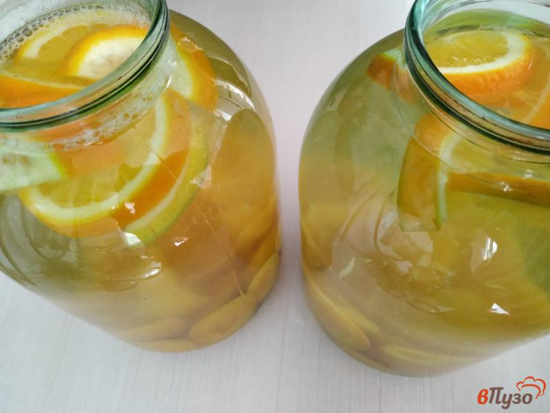 Фото приготовление рецепта: Абрикосовый компот с апельсином и лимоном шаг №6