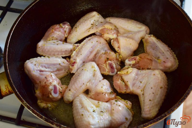 Фото приготовление рецепта: Куриные крылышки в апельсиновом маринаде шаг №5