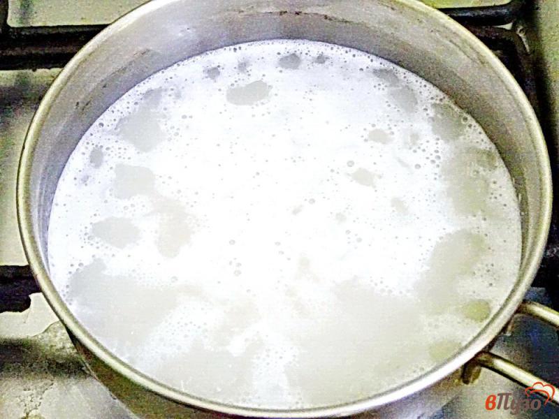 Фото приготовление рецепта: Рисовая каша молочная шаг №2