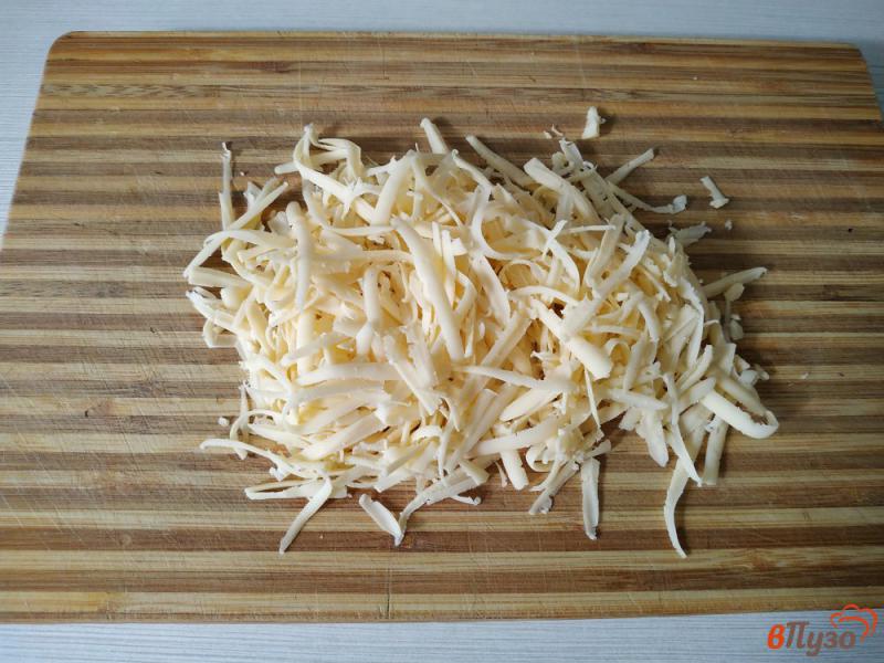 Фото приготовление рецепта: Молодой картофель запеченный под сырной корочкой шаг №6