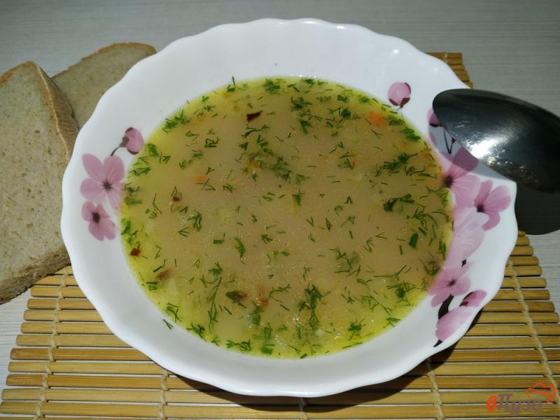 Фото приготовление рецепта: Куриный суп с овсяными хлопьями и кукурузой шаг №8