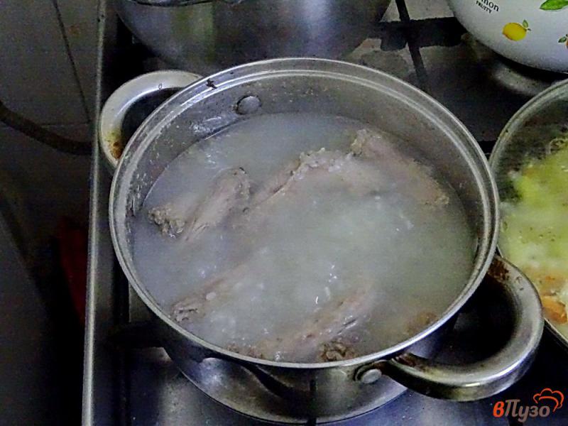 Фото приготовление рецепта: Рисовый суп на курином бульоне шаг №2