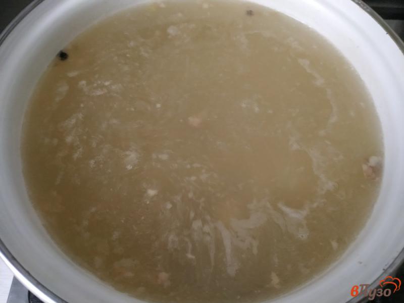 Фото приготовление рецепта: Рисовый суп со свиной тушенкой шаг №7