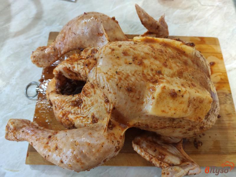 Фото приготовление рецепта: Курица запёченная с апельсином и сливочным маслом шаг №5