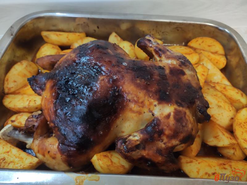 Фото приготовление рецепта: Курица запёченная с апельсином и сливочным маслом шаг №9