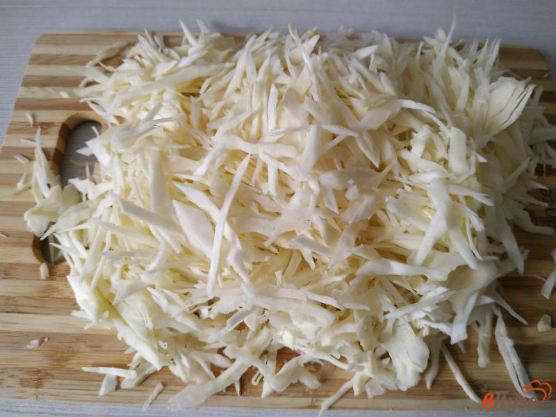 Фото приготовление рецепта: Тушёная капуста с кровяной колбасой шаг №5